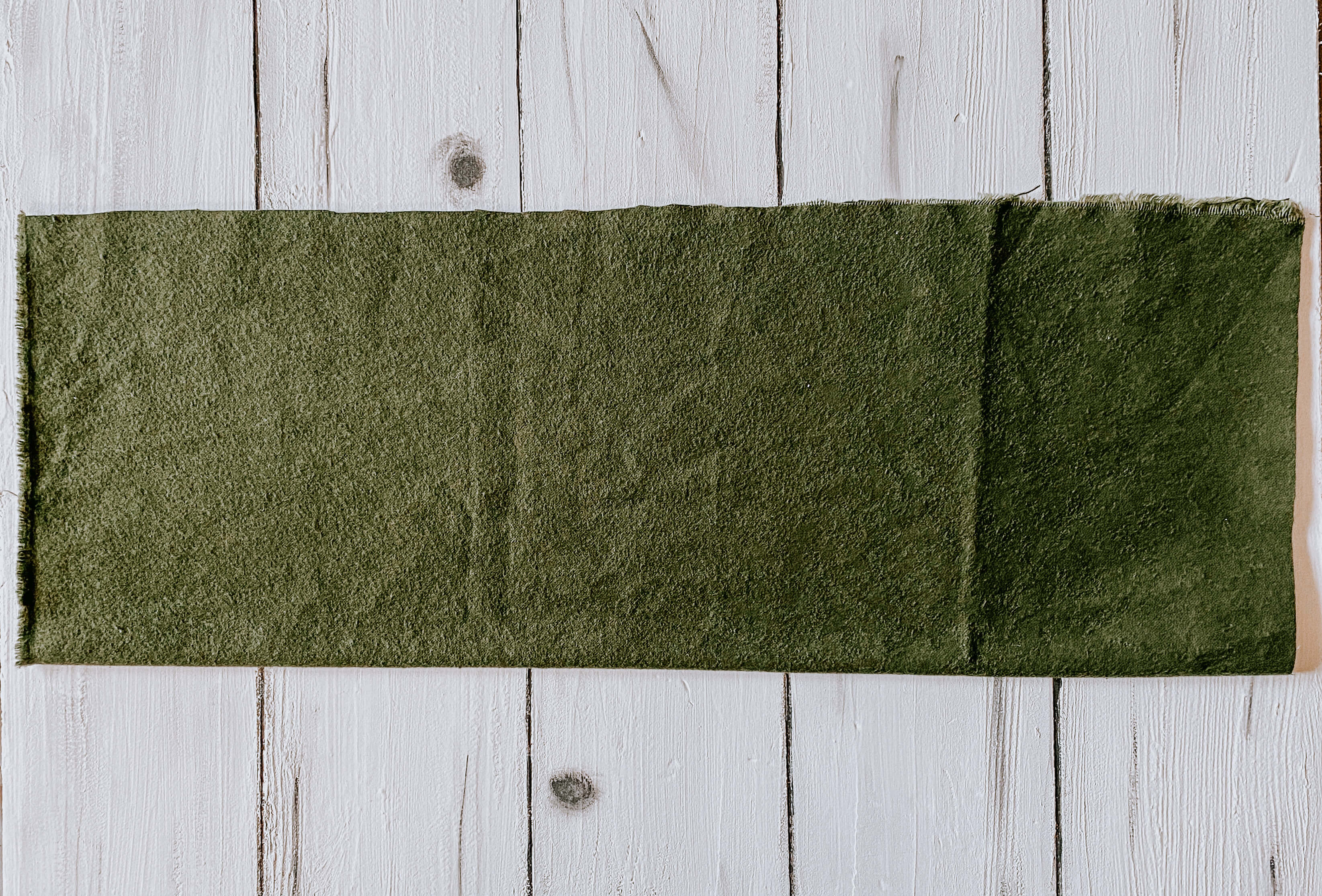 green fabric folded in half