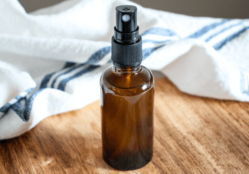 DIY room spray with essential oils in an amber spray bottle